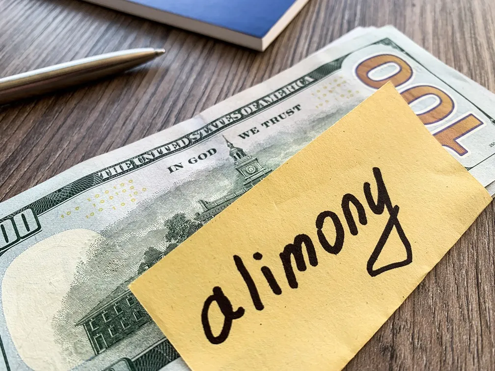 Alimony written on piece of paper.