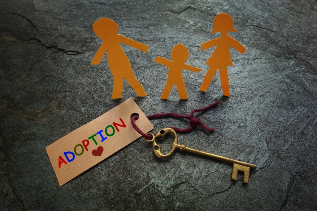 Adoption tag tied to a key.