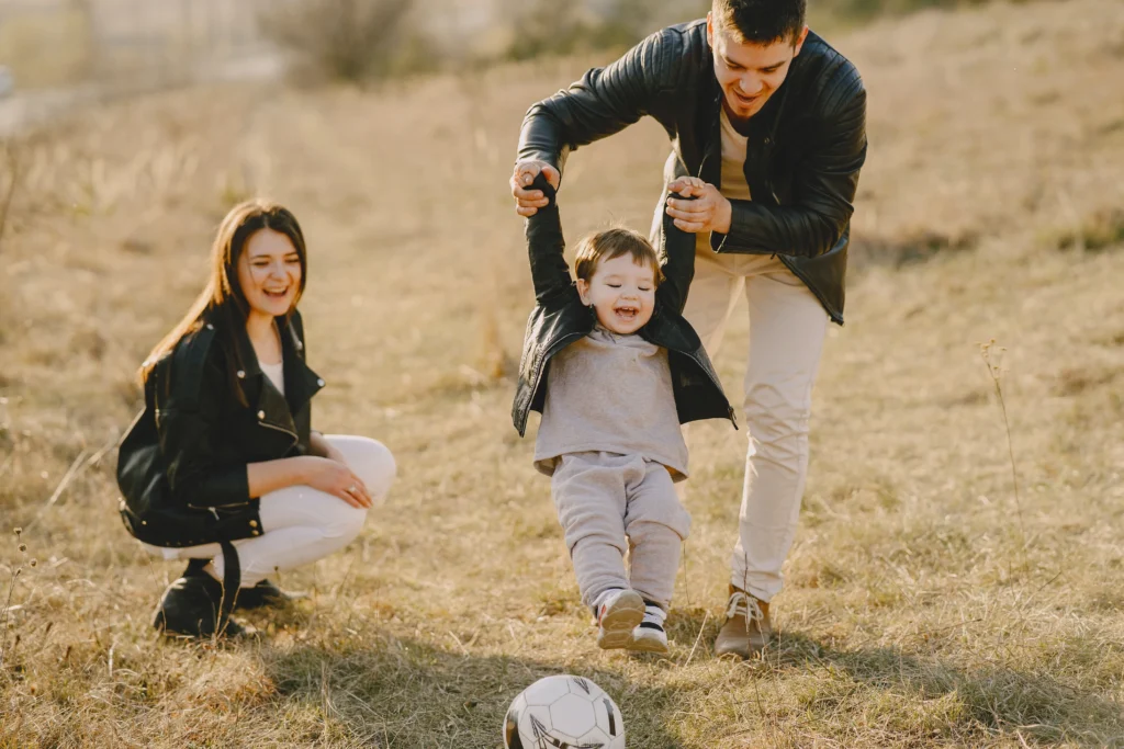 A happy family playing outside.