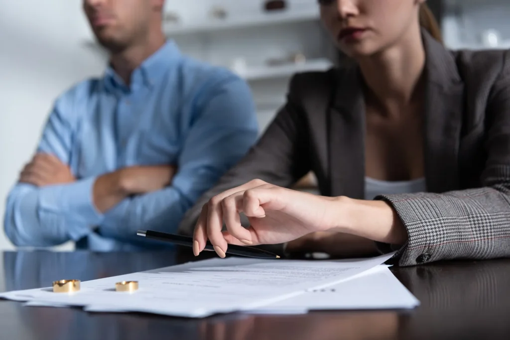 Woman and man placing rings on a table.