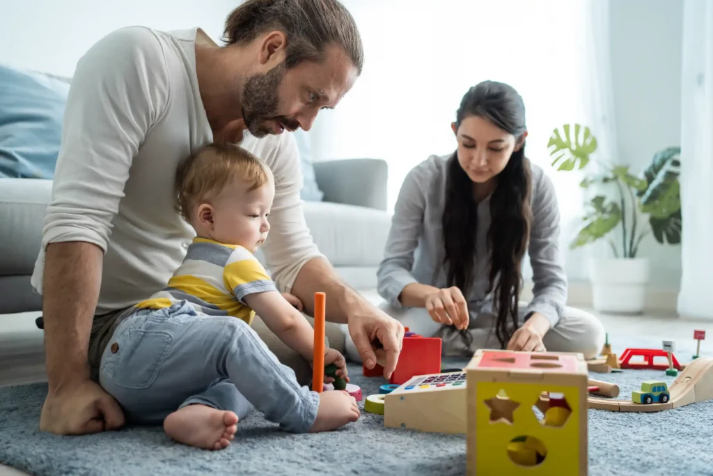 A family playing with toys.